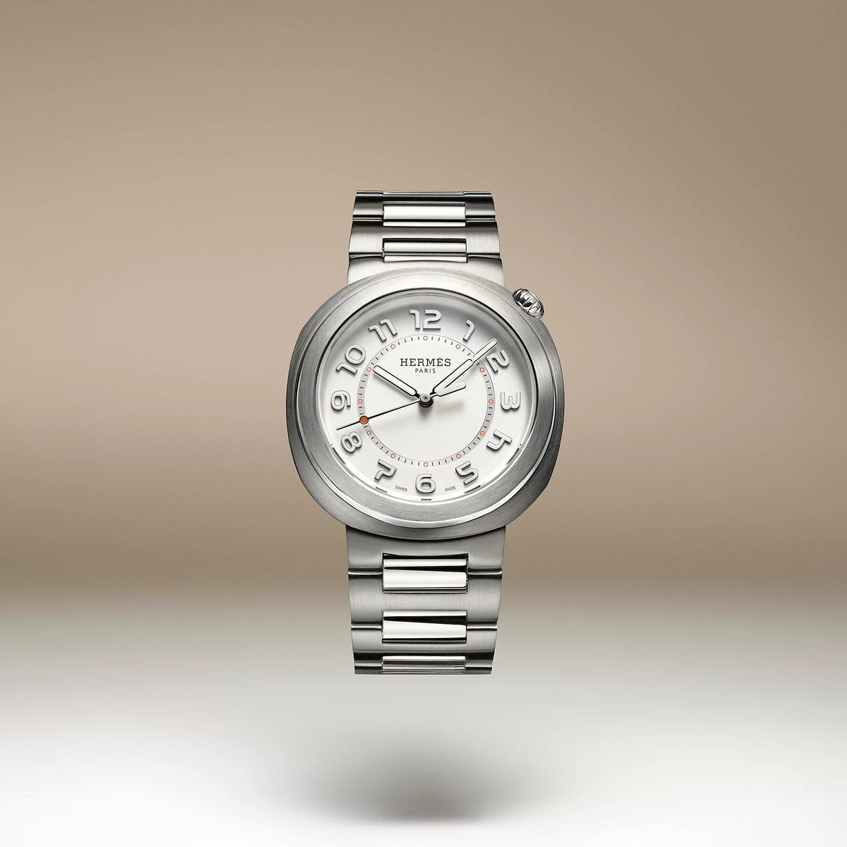 Hermes Cut watches stacked, showing the circle within a round case design