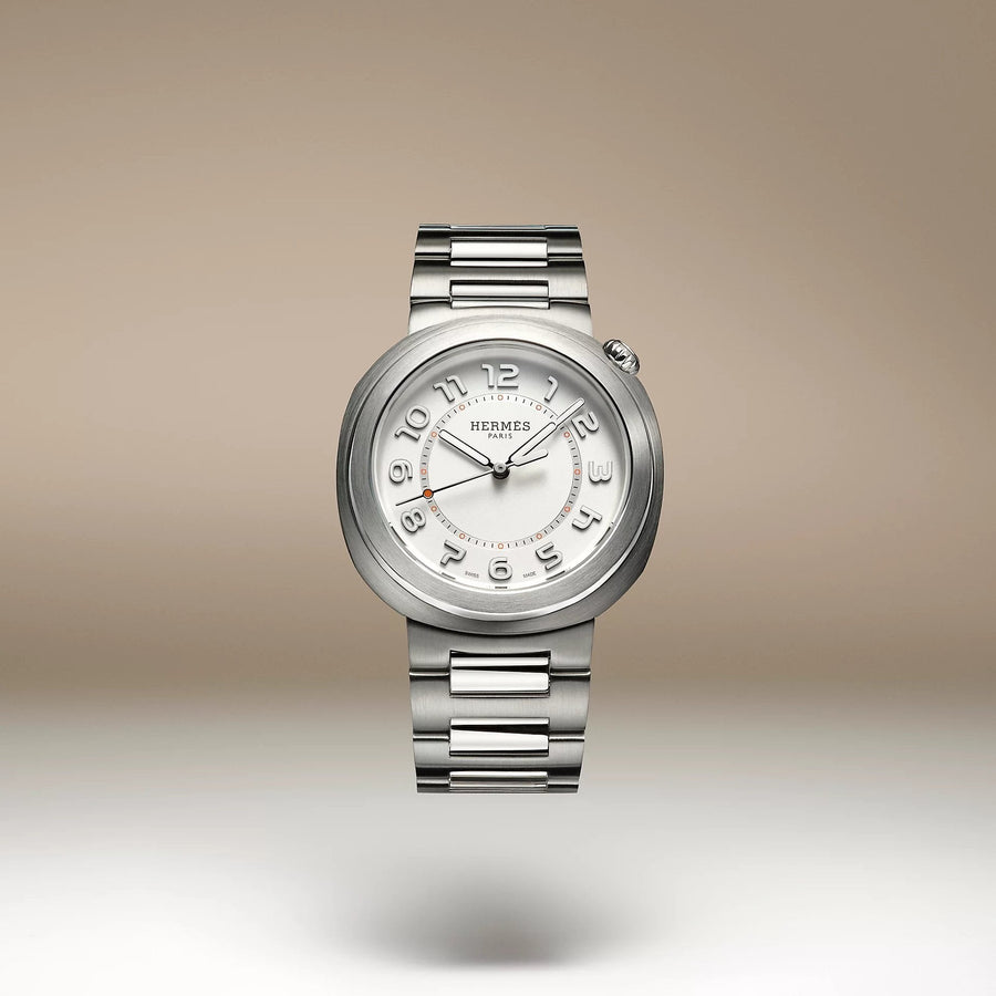 Hermes Cut watches stacked, showing the circle within a round case design