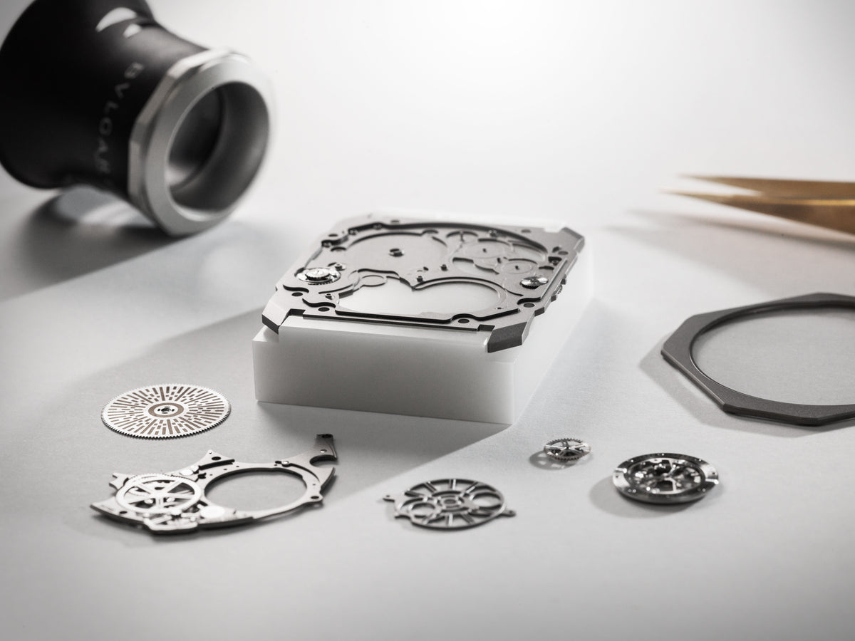 Watchmaker's bench with a disassembled Bvlgari movement