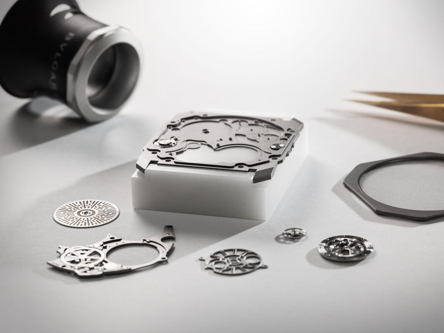 Watchmaker's bench with a disassembled Bvlgari movement