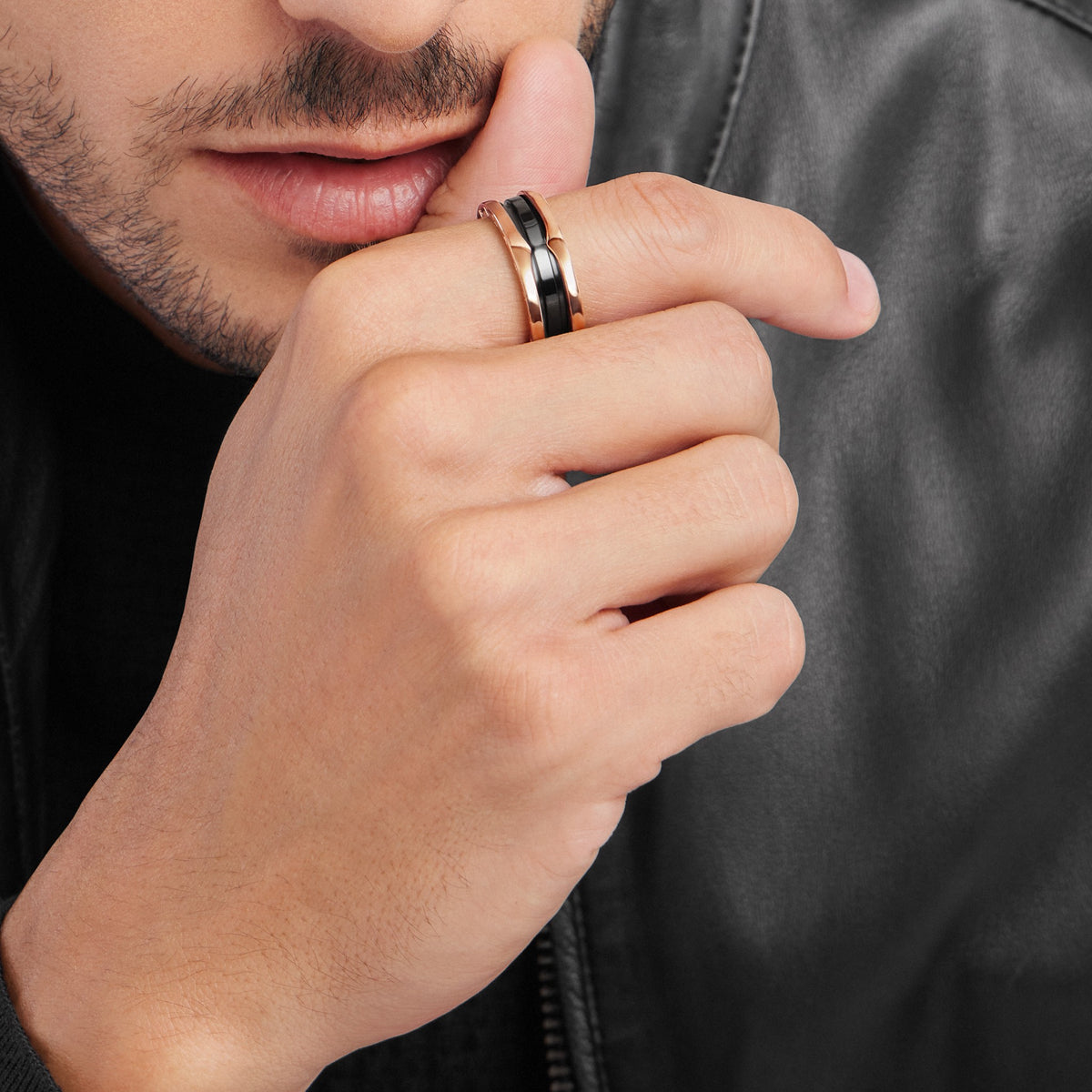 Bvlgari B.zero1 ring in rose gold and black ceramic worn on hand
