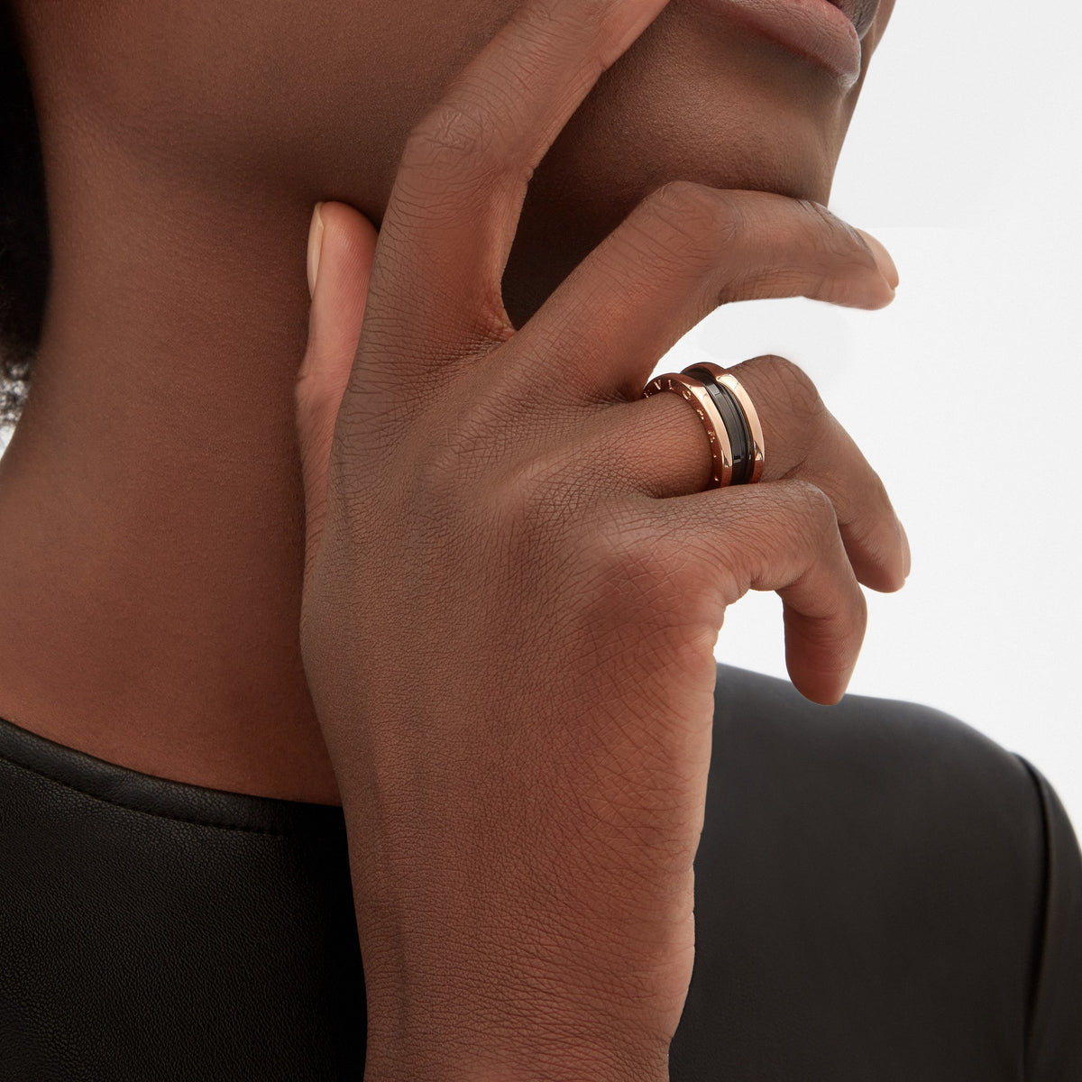 Bvlgari B.zero1 ring in rose gold and black ceramic worn on hand