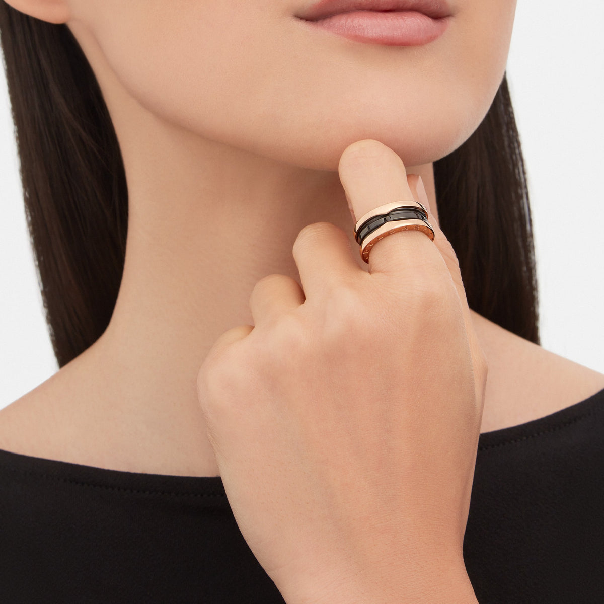 Bvlgari B.zero1 ring in rose gold and black ceramic worn on hand