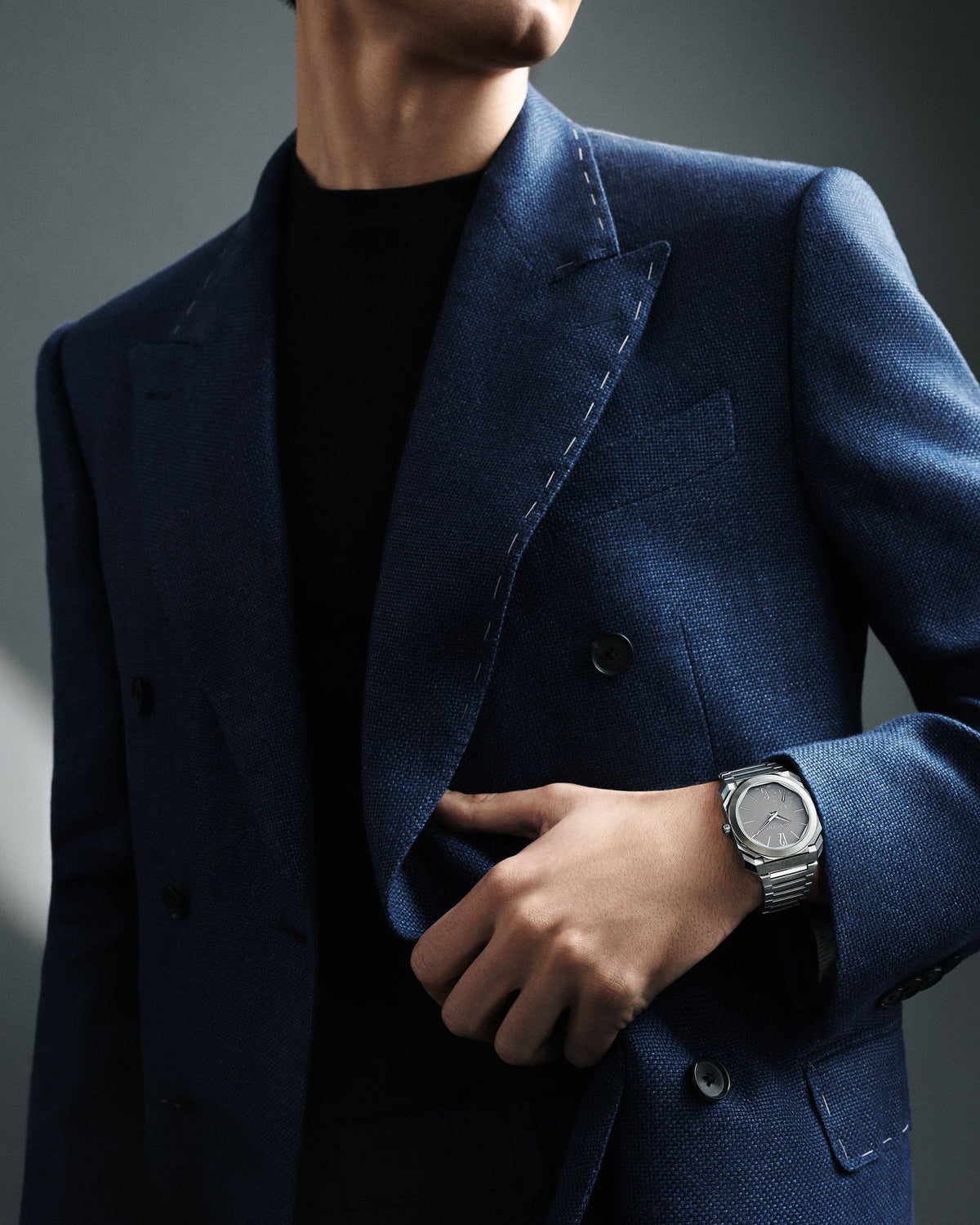 Bvlgari Octo Finissimo in steel worn with a tailored blue jacket