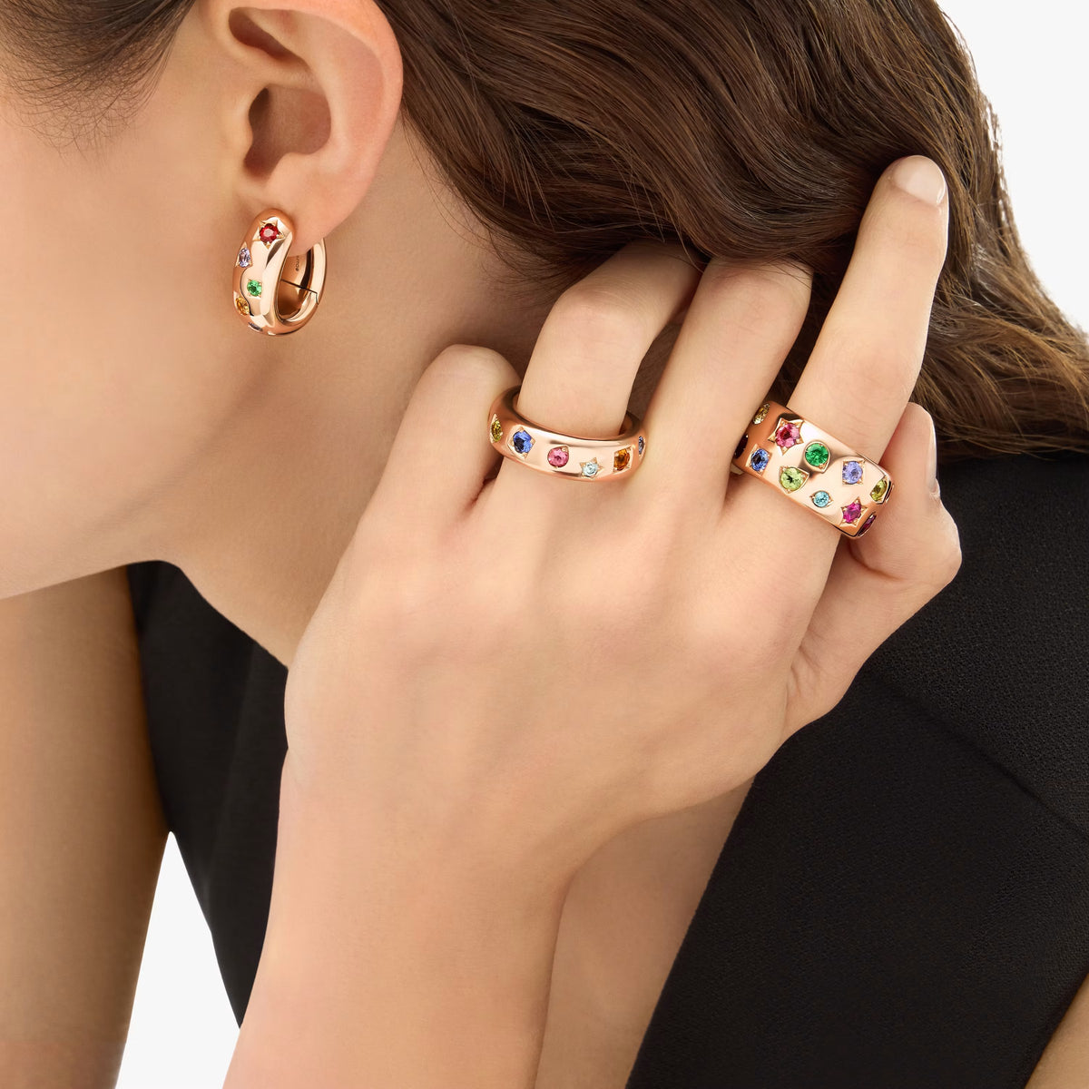 Pomellato Iconica rose gold hoops and rings set with coloured gemstones, worn