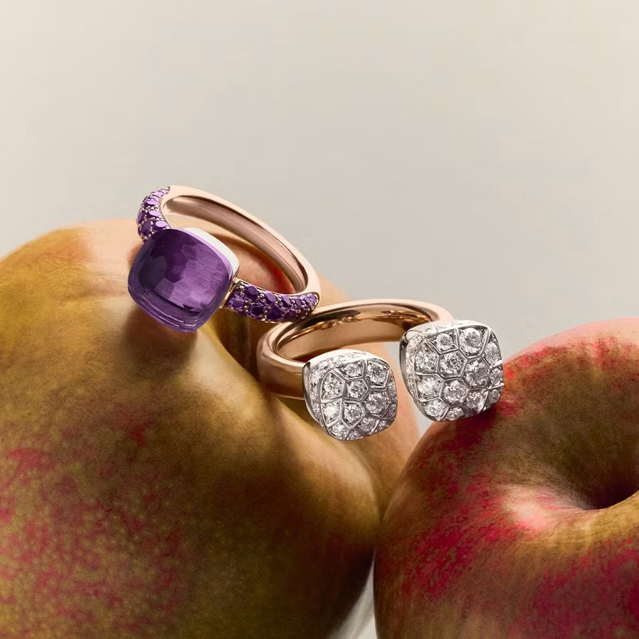 Pomellato Nudo rings in amethyst and diamond pave resting on apples