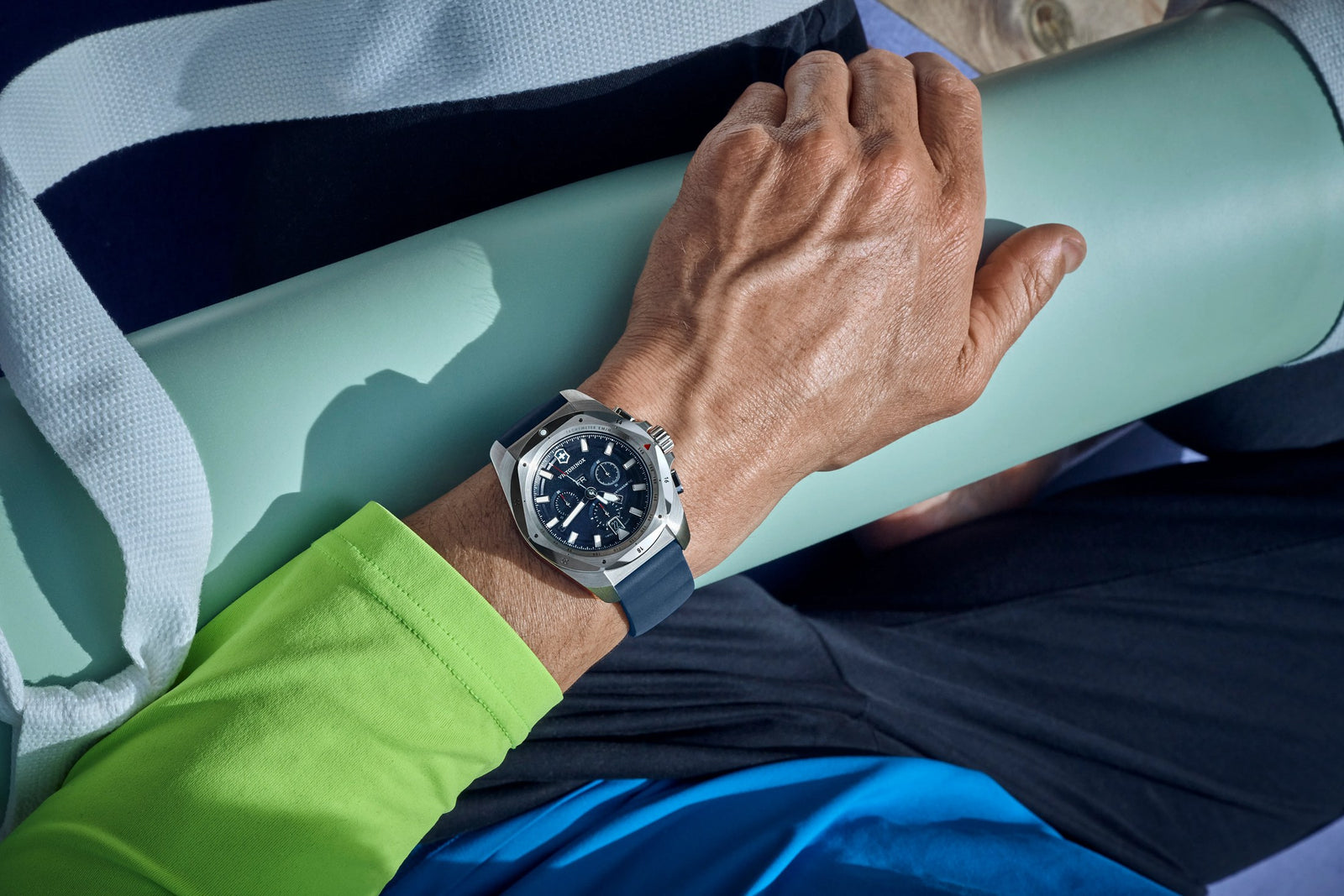 Victorinox watch worn while carrying a yoga mat
